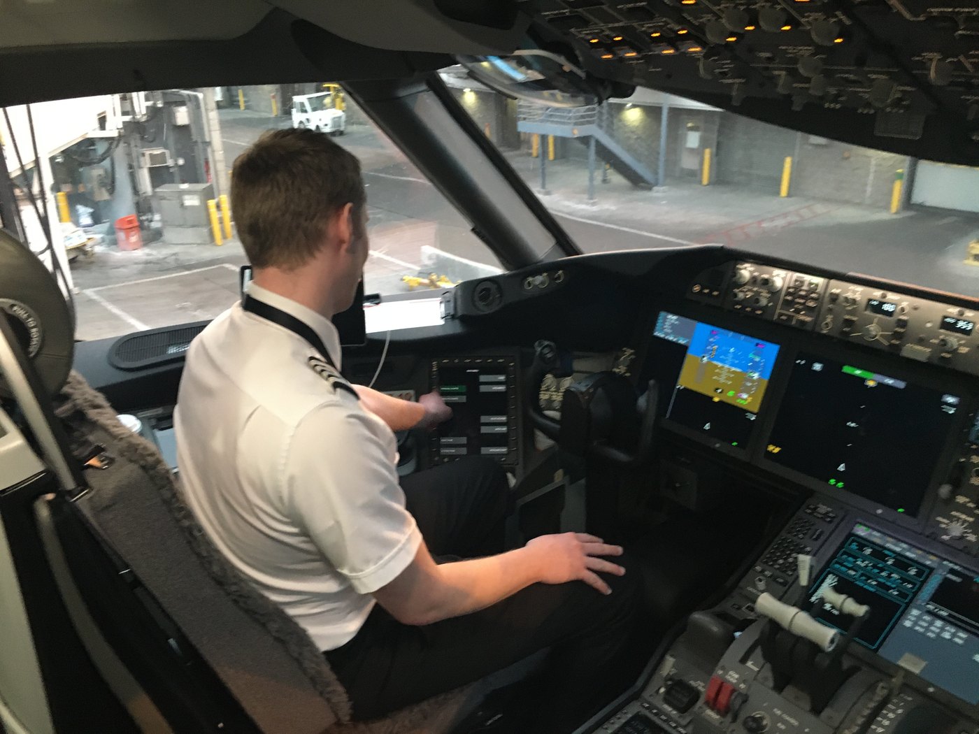 Ethan Collins in the left seat at the controls of a glass-cockpit turboprop